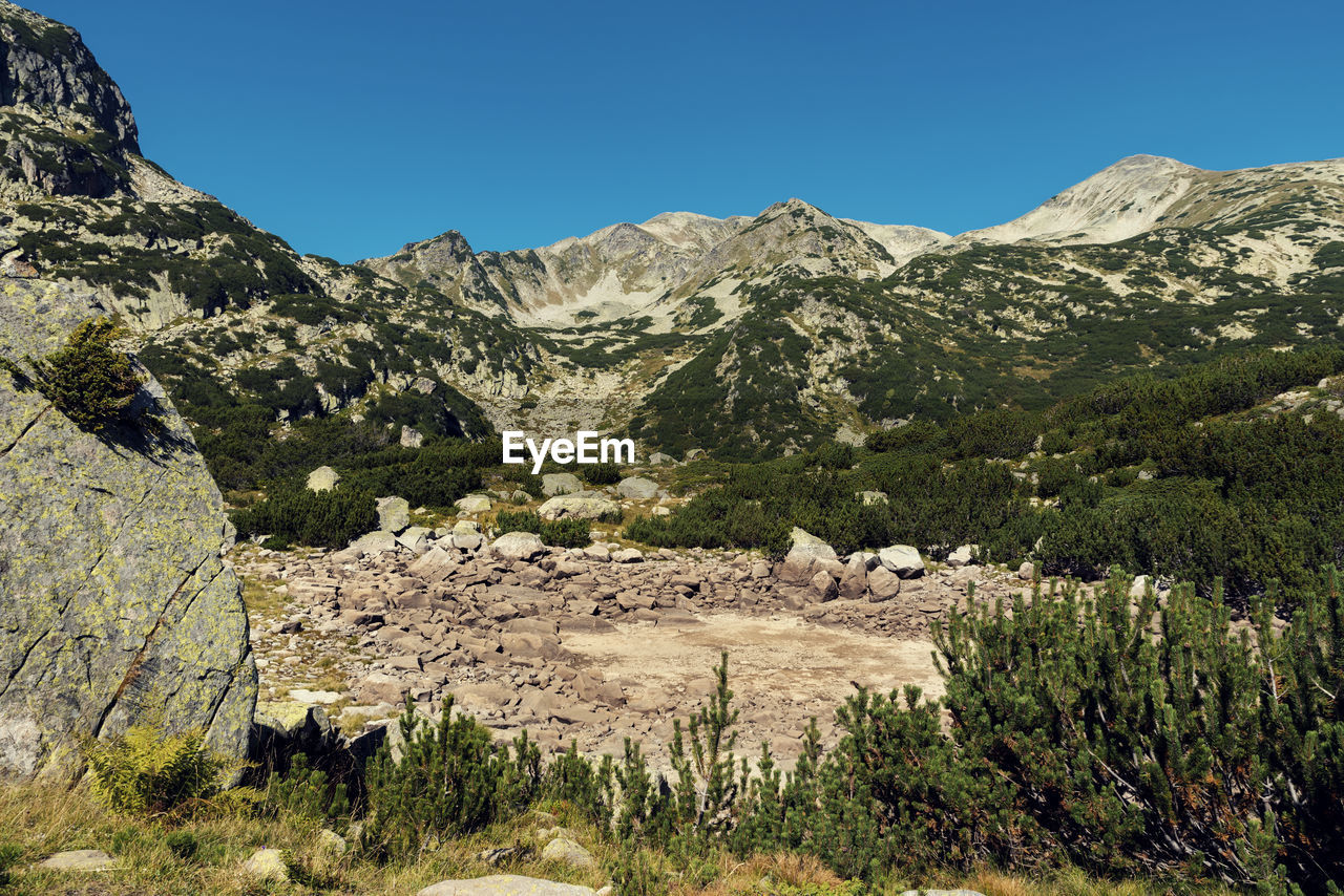 View of a dry alpine lake in pirin national park in bulgaria result of global climate change 