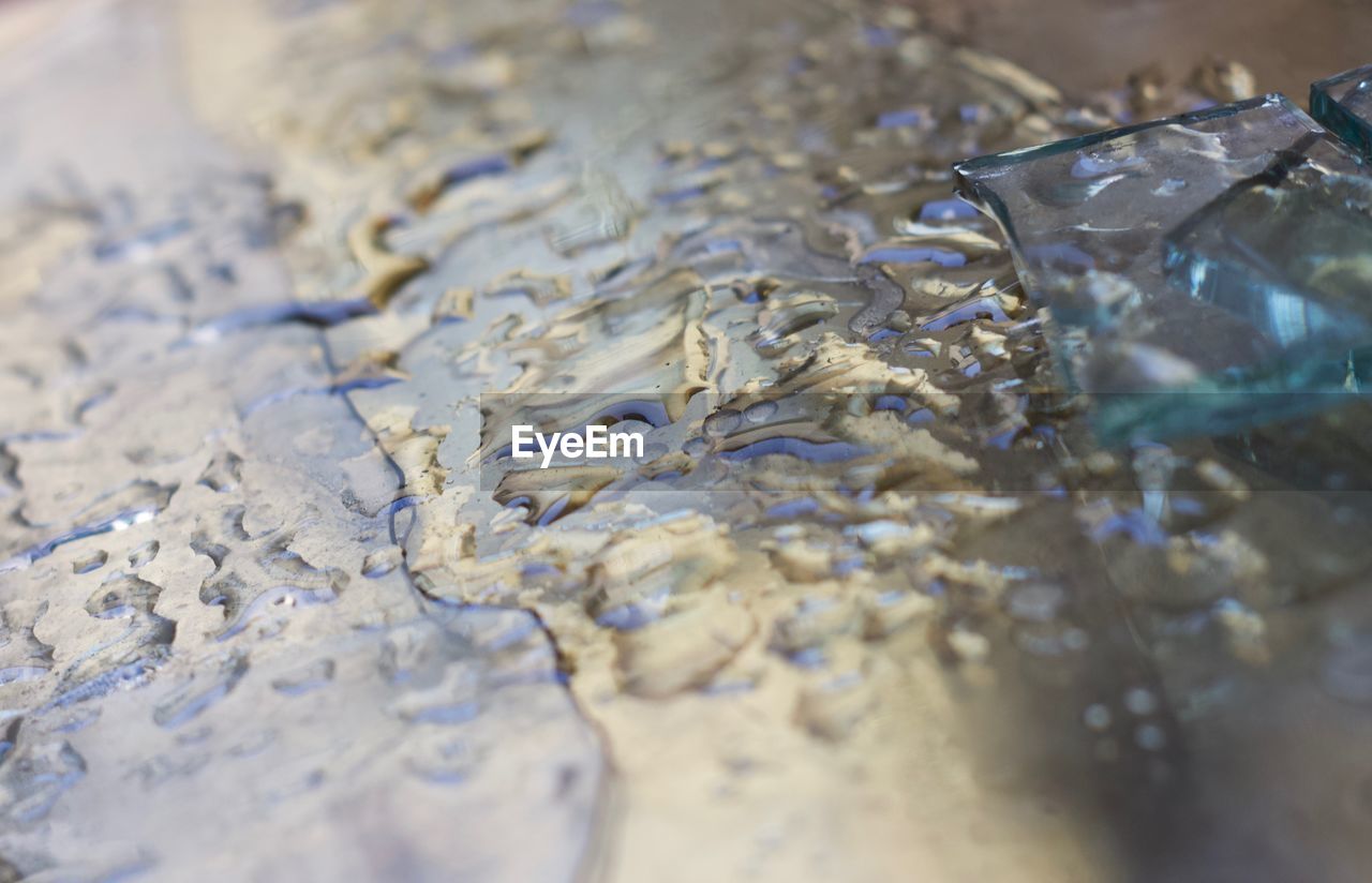 Full frame shot of  water on glass mirror surface 