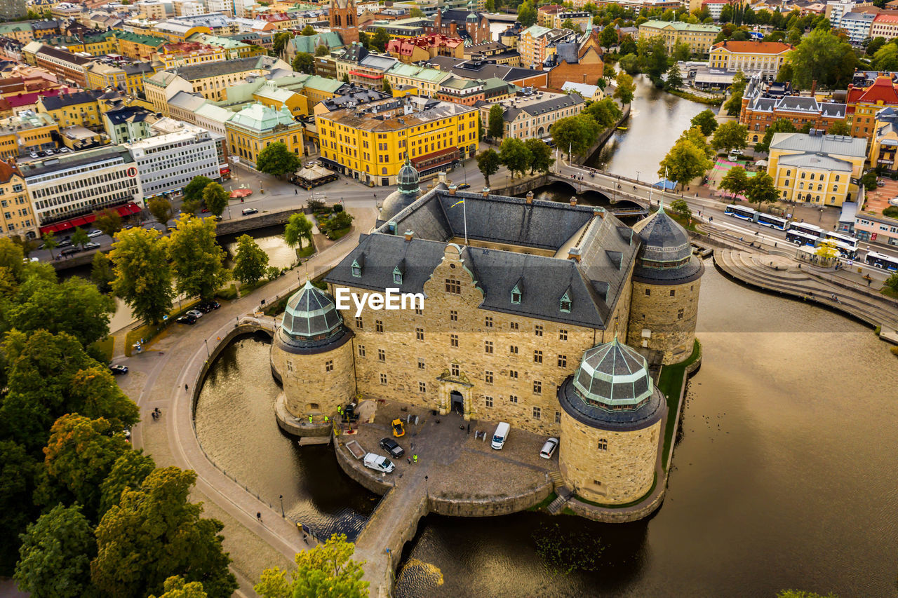 High angle view of river amidst buildings in city