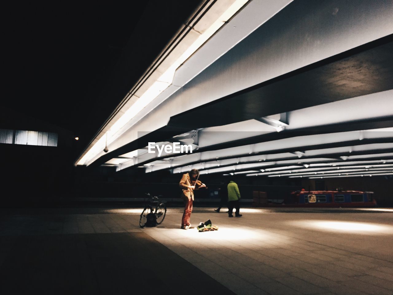 People on illuminated footpath 