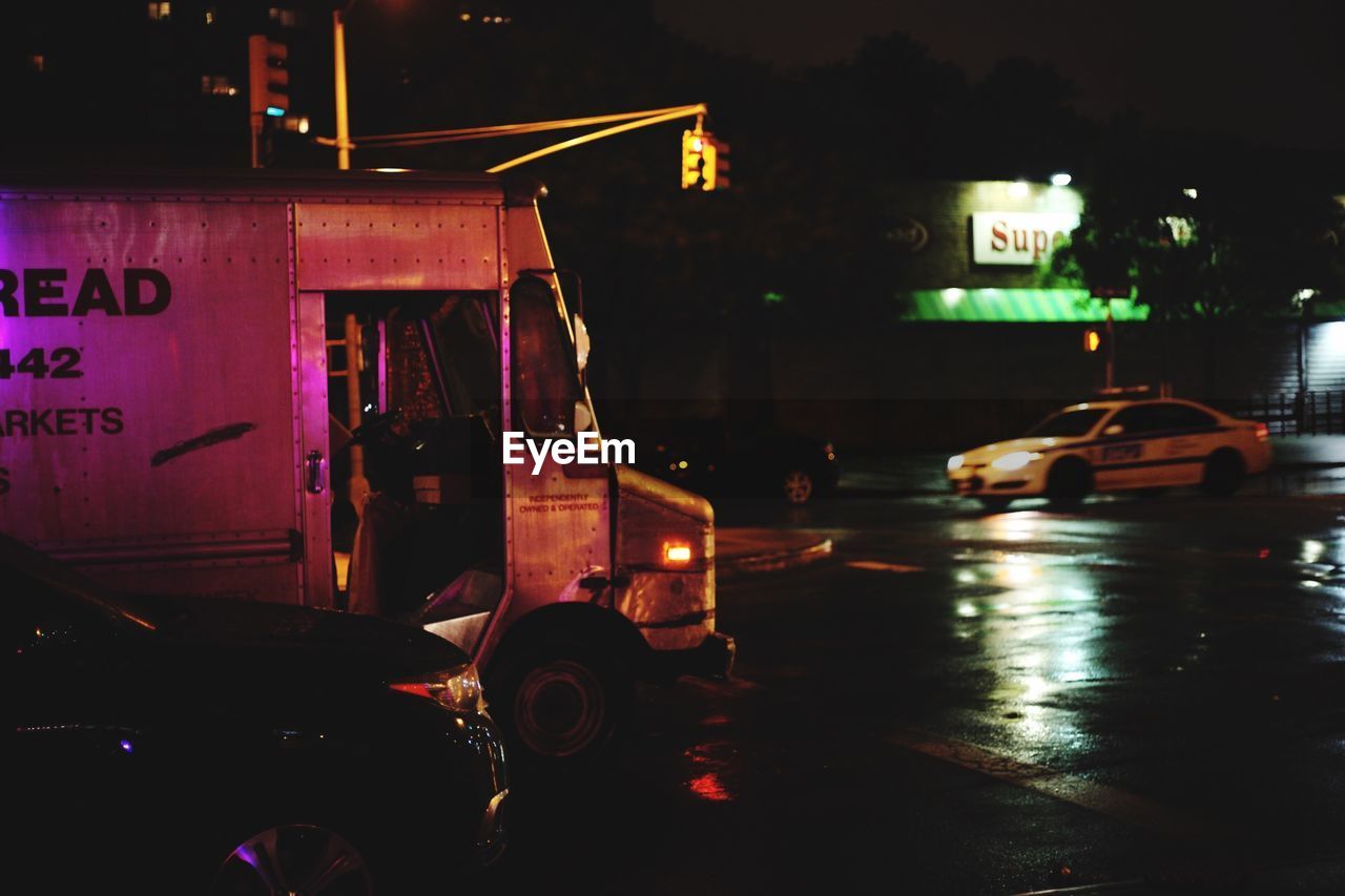 Vehicles on street at night