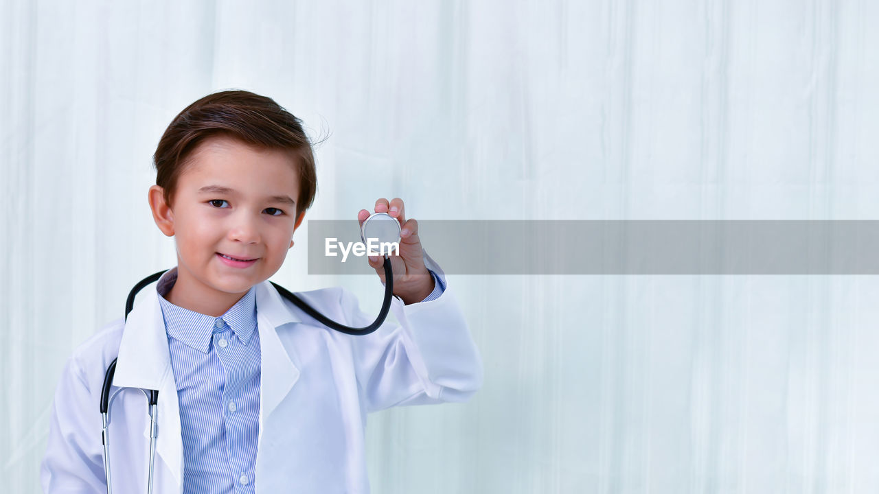 Portrait of boy dressed up as doctor