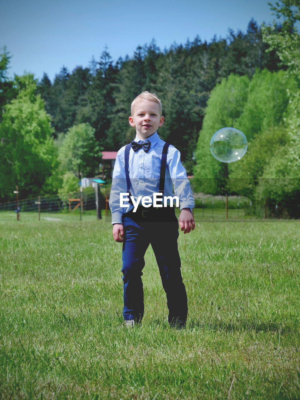 Little boy playing with bubbles