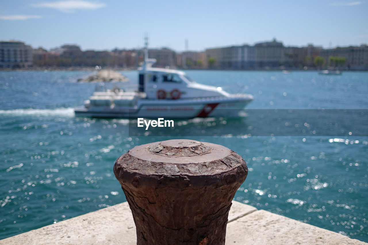 Close-up of bollard at port