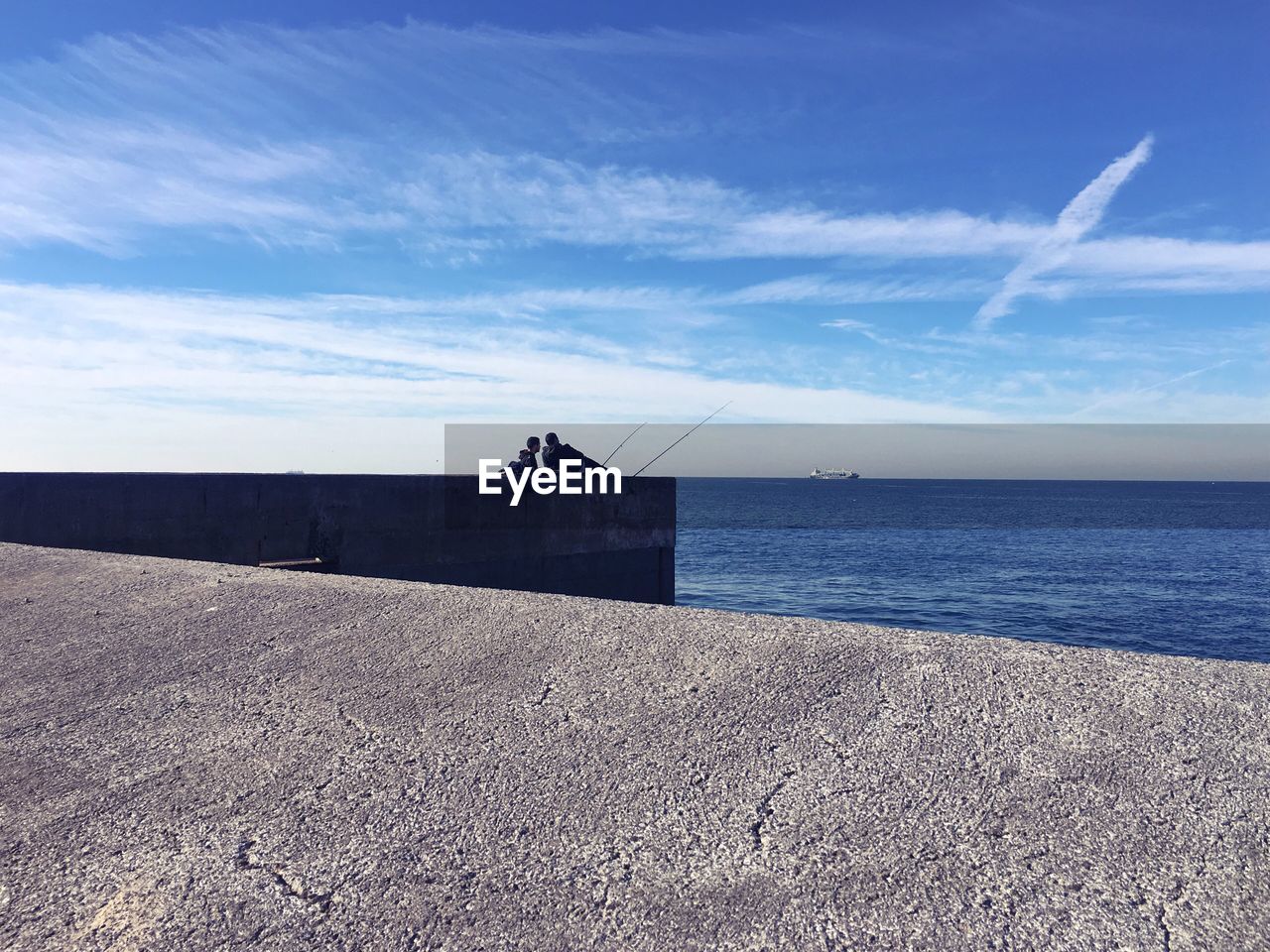 Scenic view of sea against blue sky