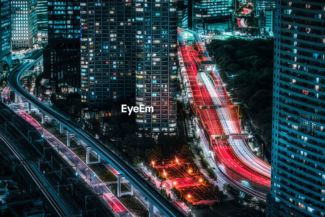 High angle view of illuminated city buildings at night