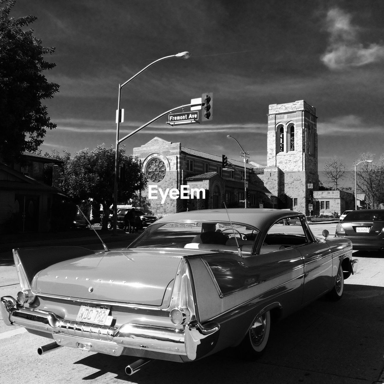 VIEW OF CITY STREET WITH CARS