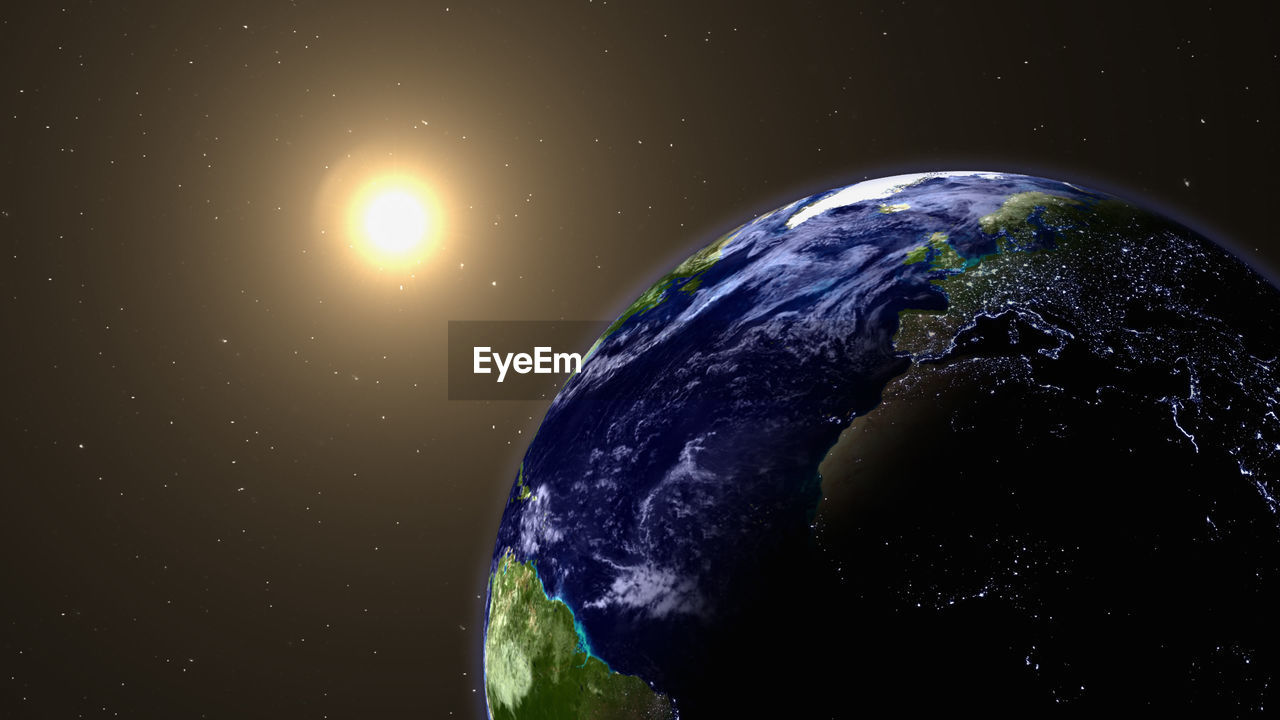 Satellite view of earth against sun