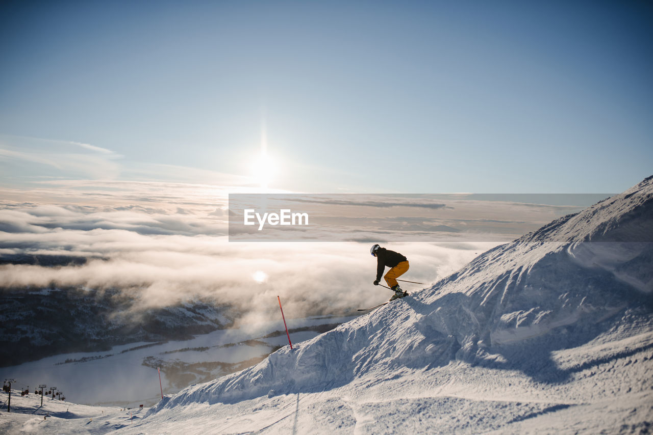 Skier skiing in ski resort in winter