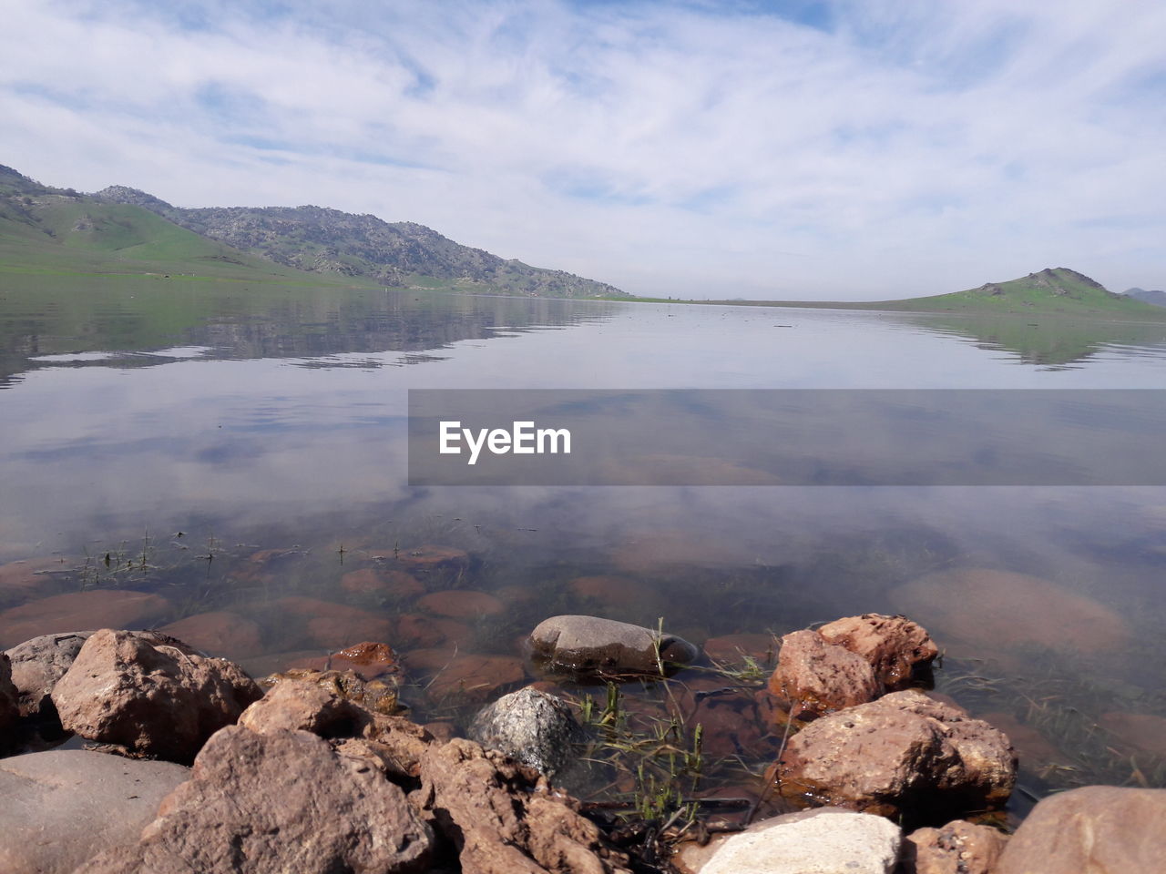 REFLECTION OF SKY IN LAKE