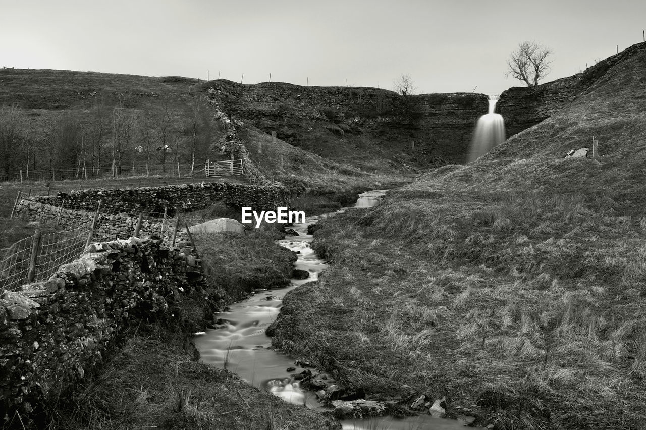 environment, black and white, rock, landscape, nature, sky, monochrome photography, land, monochrome, scenics - nature, plant, hill, water, rural area, beauty in nature, non-urban scene, day, tranquility, no people, travel, travel destinations, coast, outdoors, tranquil scene, tourism, grass, tree, architecture