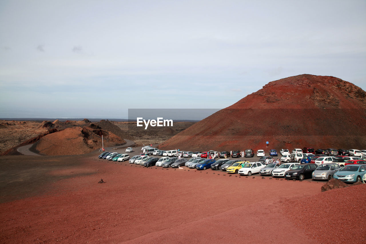 Cars parked by mountain