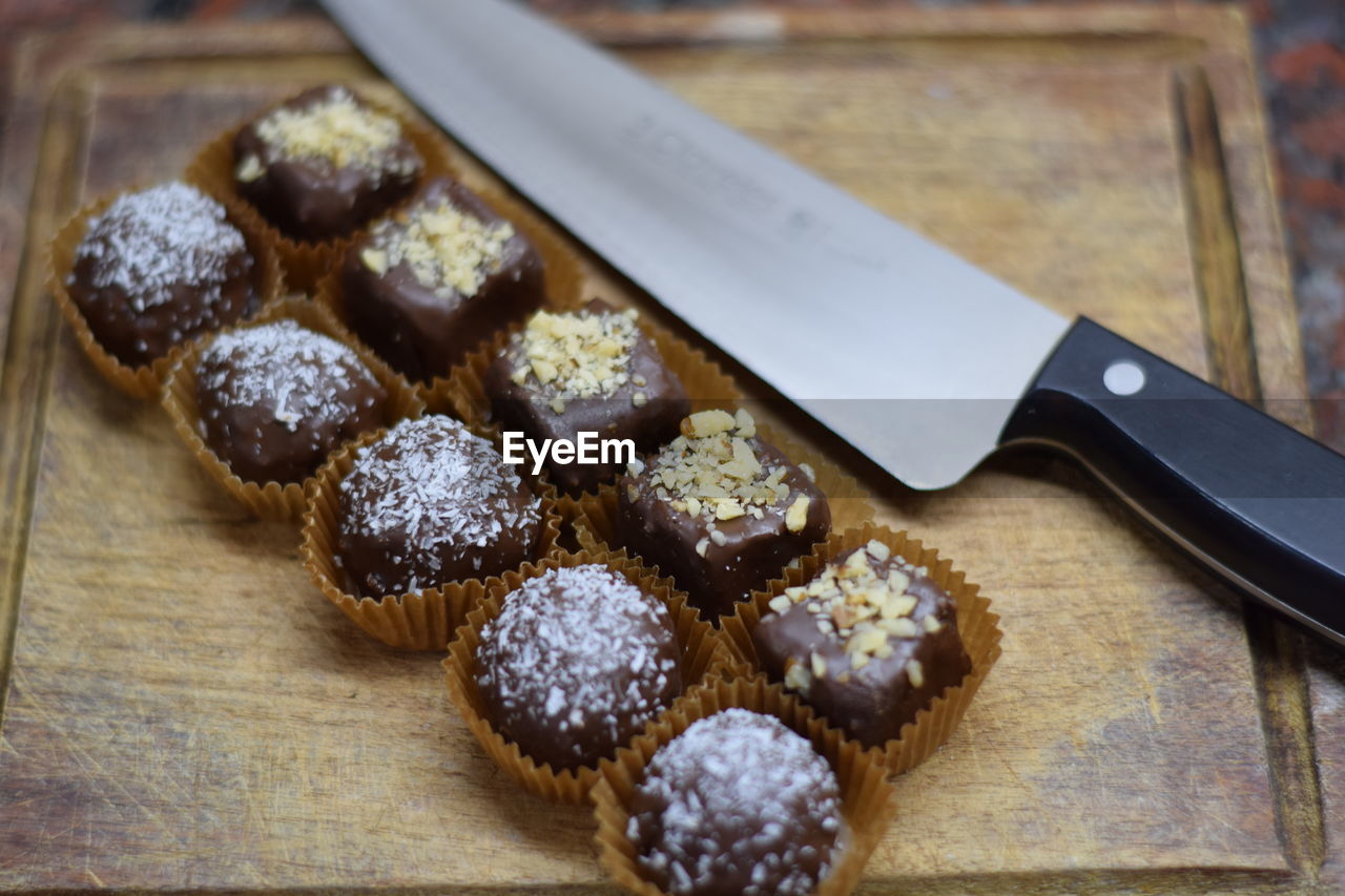 Close-up of chocolate and knife on cutting board