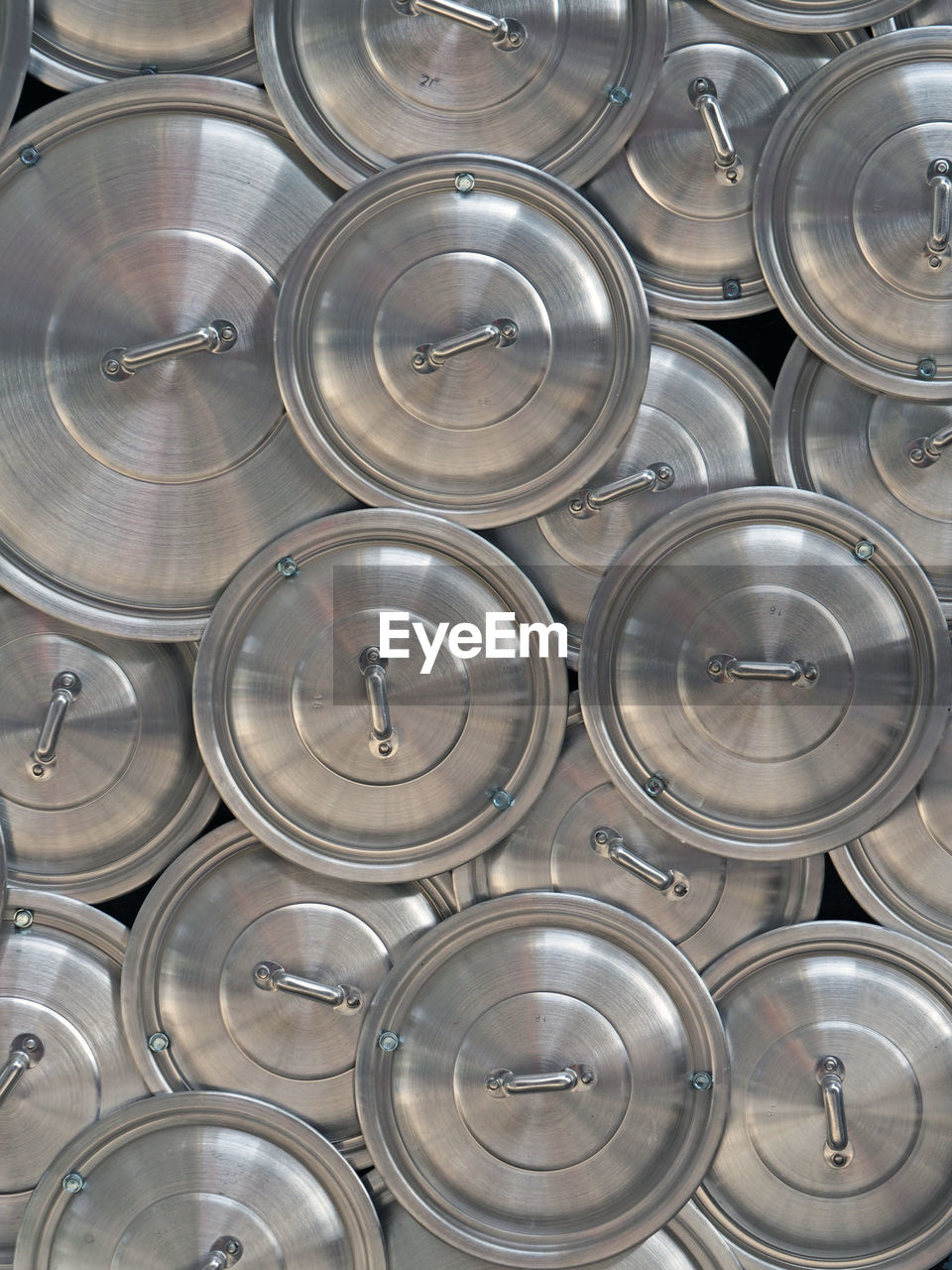 Full frame shot of casserole lids for sale at market