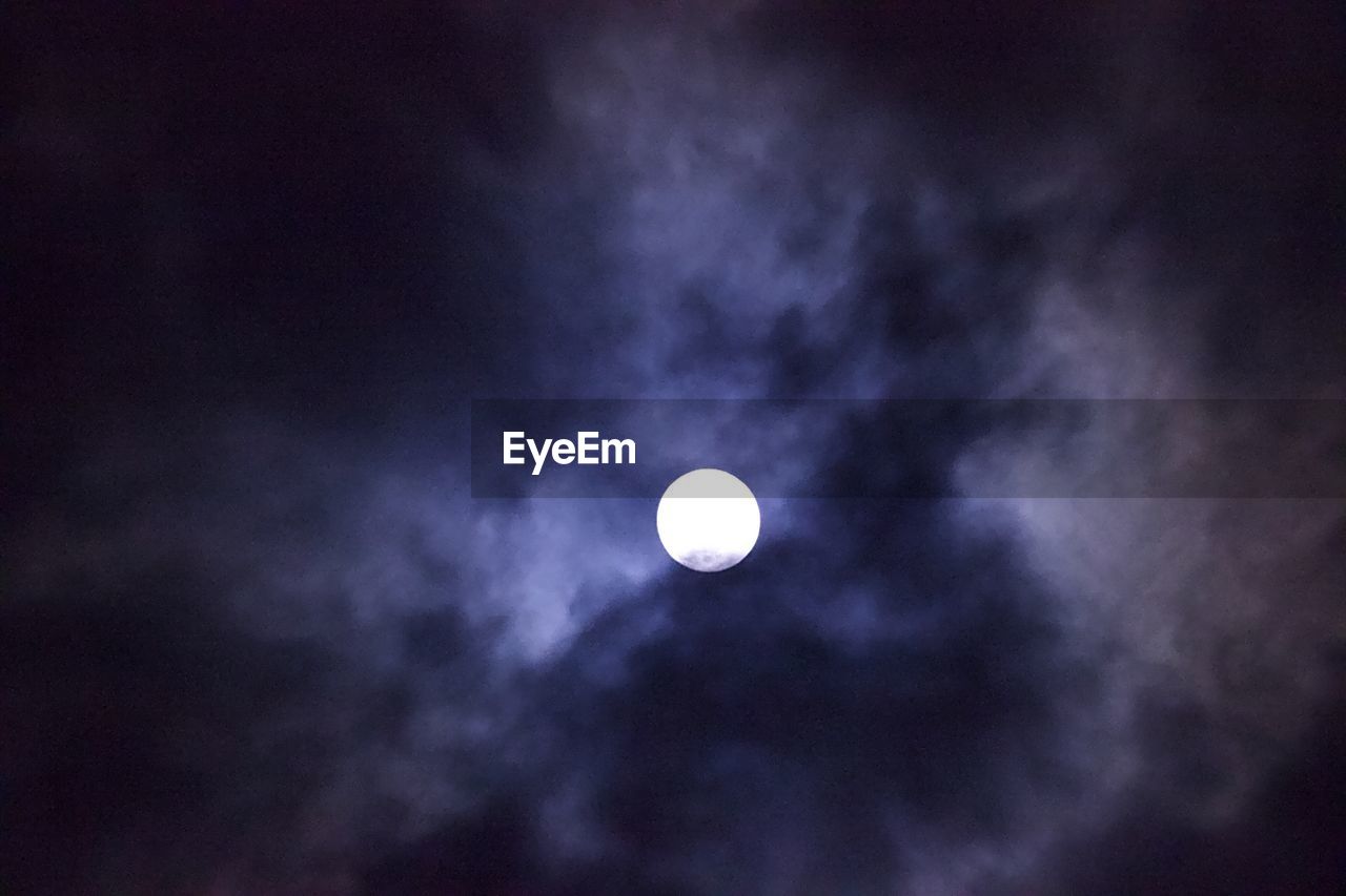 LOW ANGLE VIEW OF HALF MOON AGAINST SKY