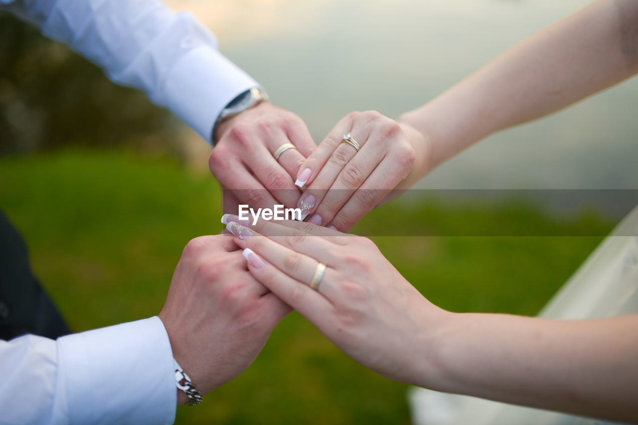 Close-up of the hands of a bride and a groom