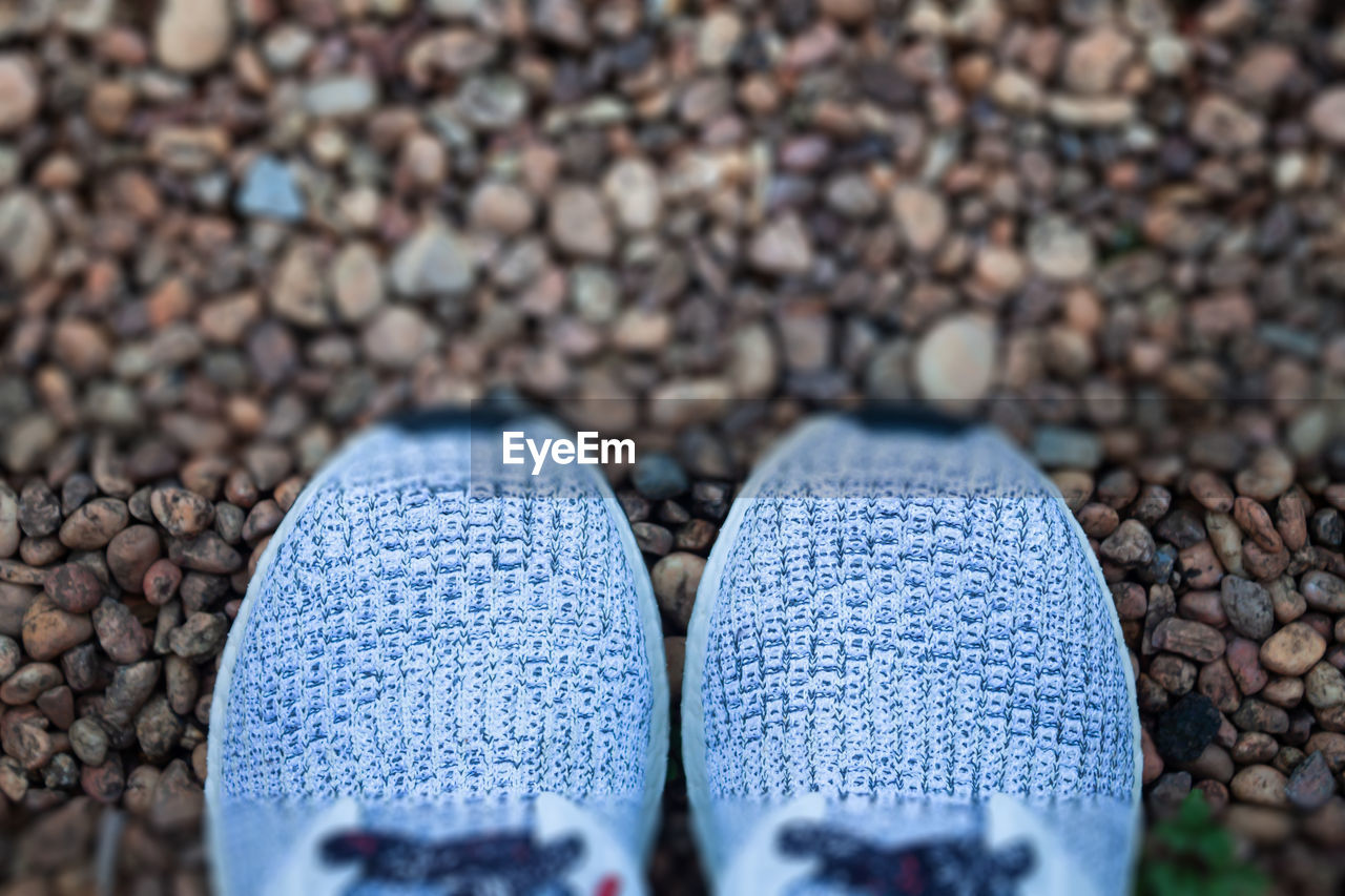 High angle view of shoes on stone