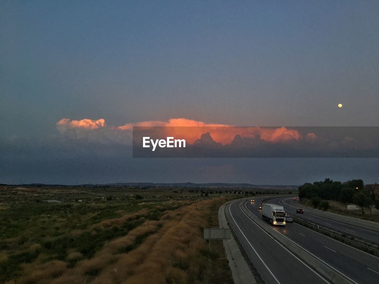 Scenic view of road against sky during sunset