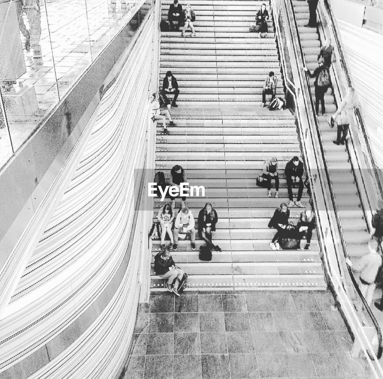 HIGH ANGLE VIEW OF PEOPLE WALKING ON STREET