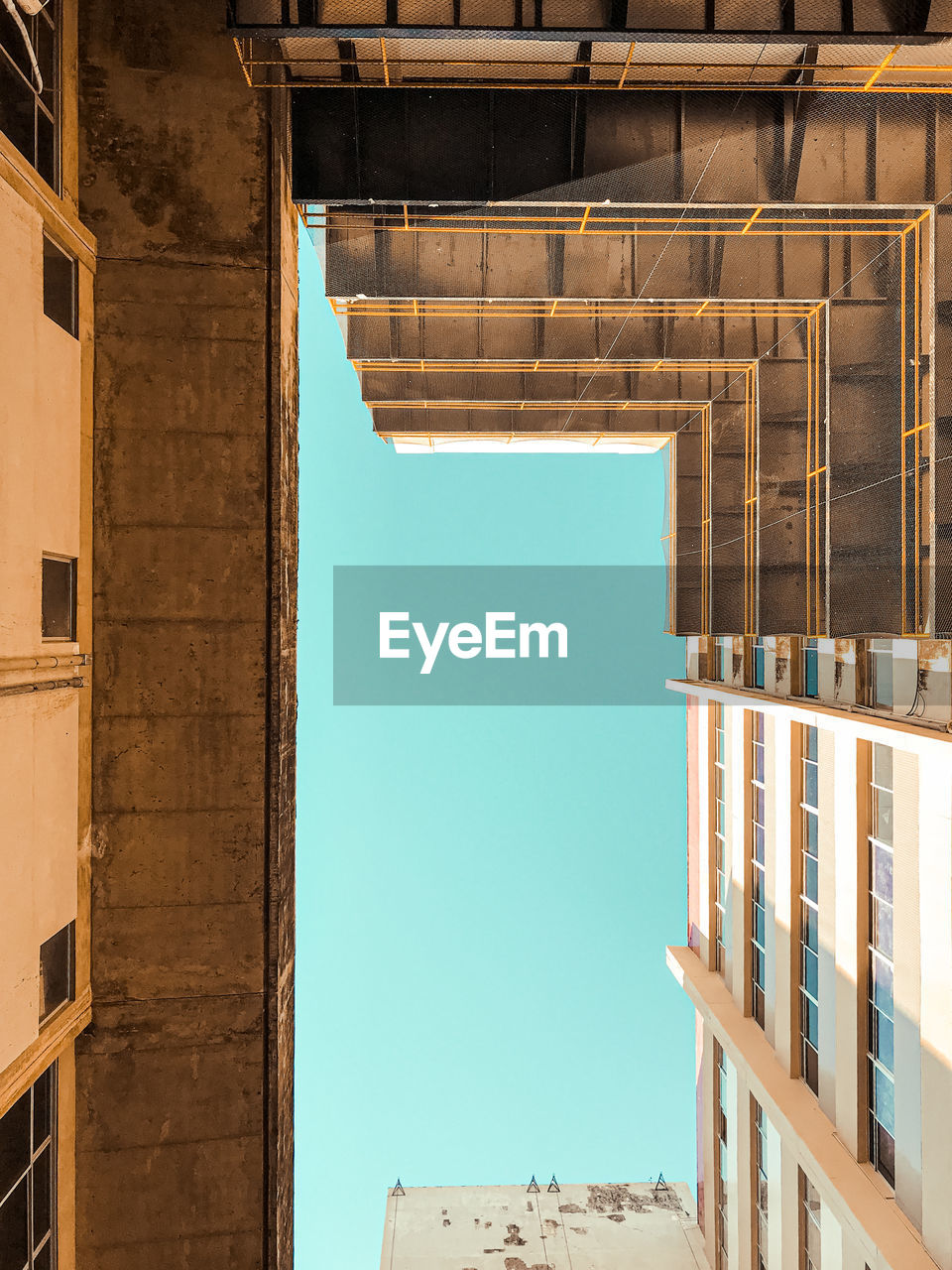 Low angle view of building against clear blue sky