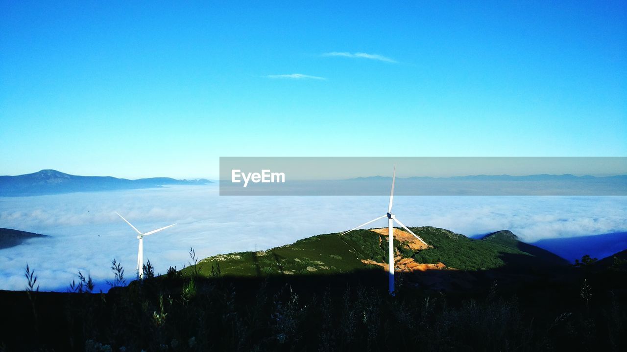 Scenic view of landscape against blue sky