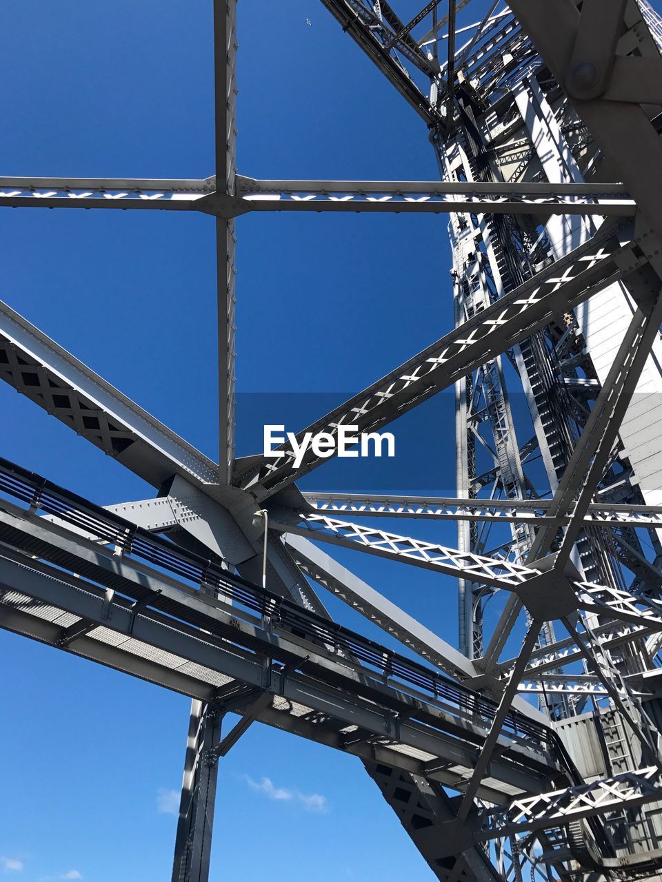 LOW ANGLE VIEW OF METALLIC STRUCTURE AGAINST CLEAR SKY