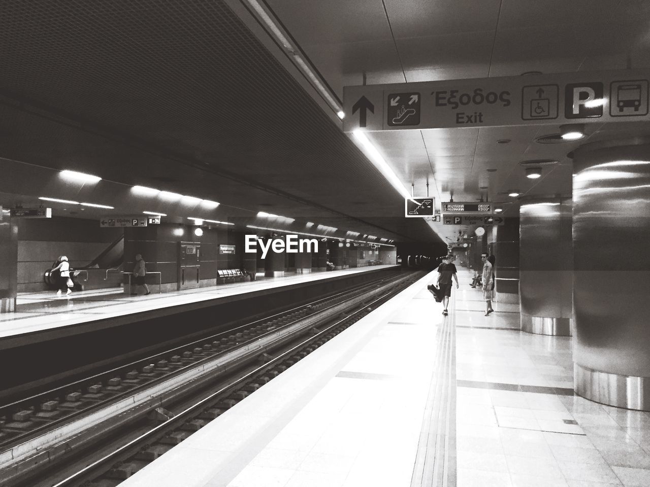 TRAIN ON RAILROAD STATION PLATFORM