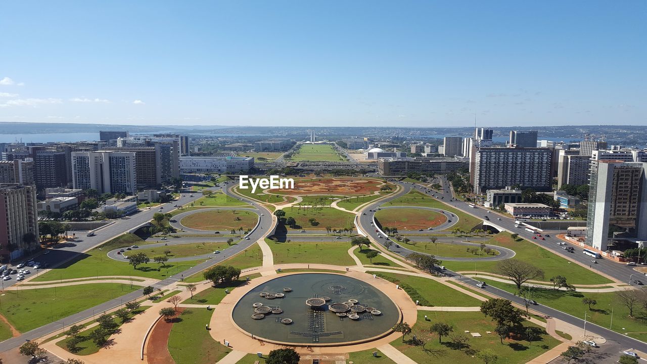 HIGH ANGLE VIEW OF CITY BUILDINGS AGAINST SKY