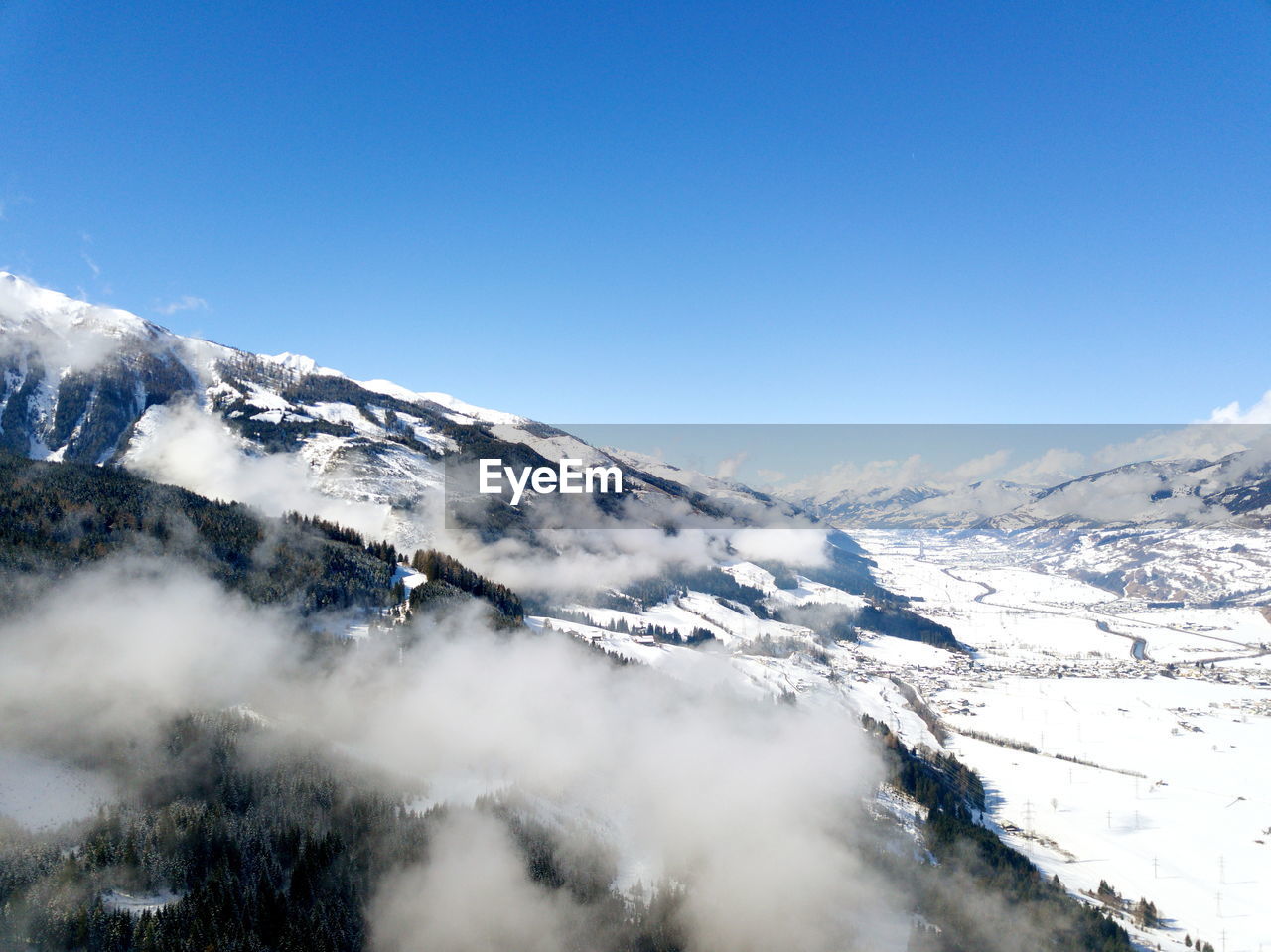 Scenic view of snow covered mountains against sky