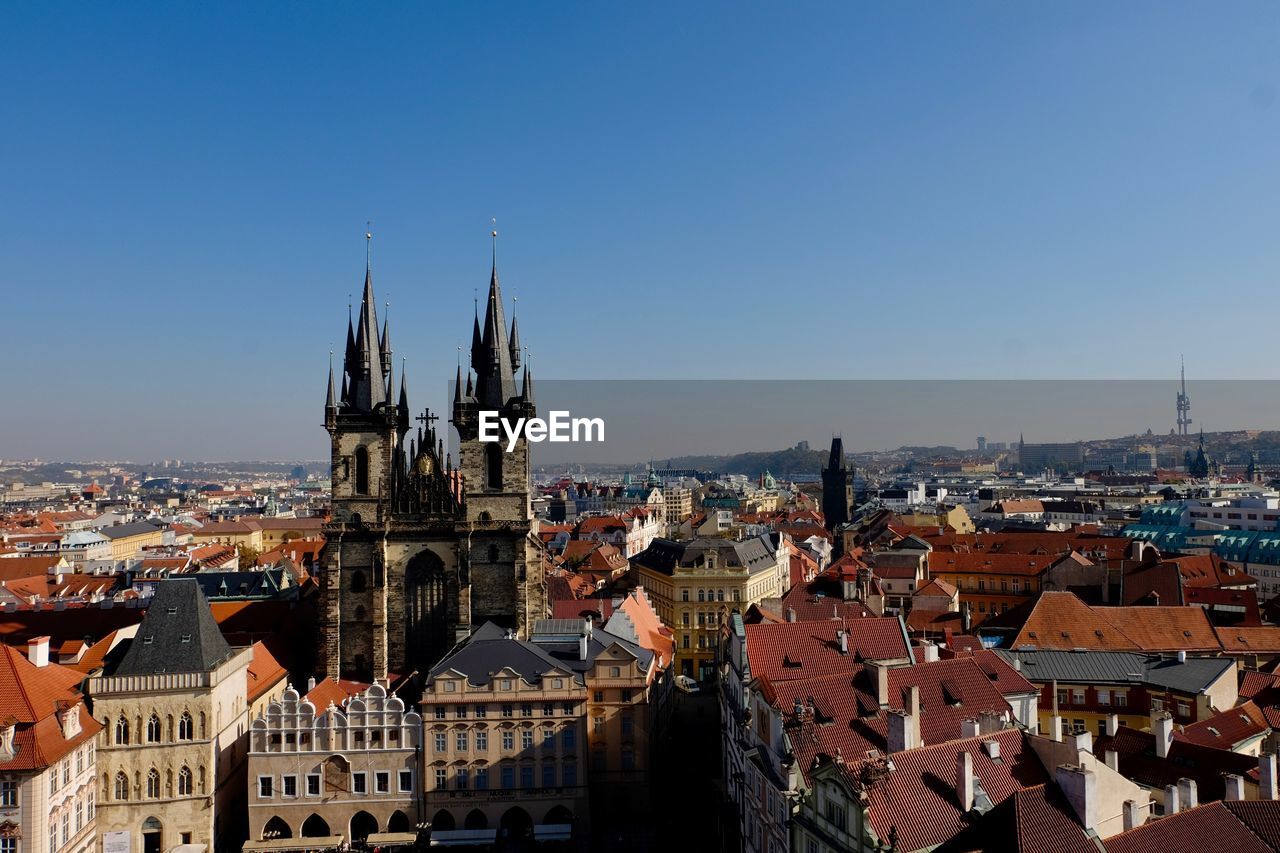 High angle view of buildings in city against clear sky