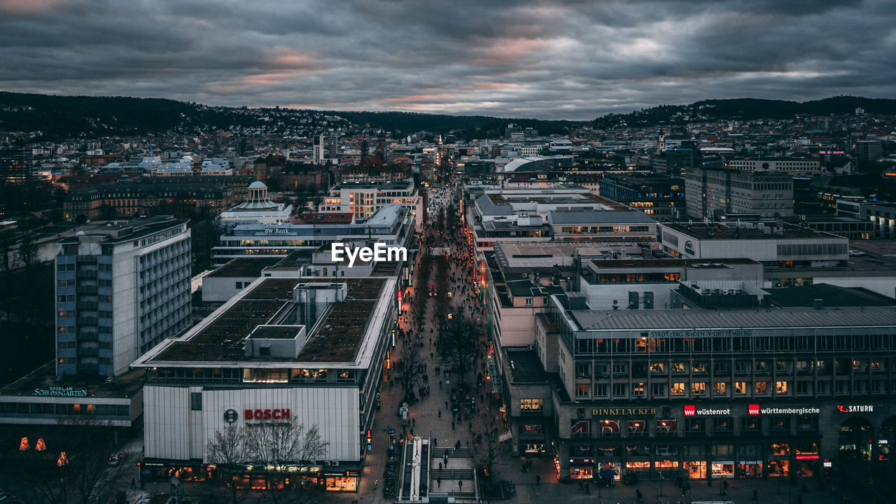 HIGH ANGLE VIEW OF ROAD AGAINST SKY IN CITY