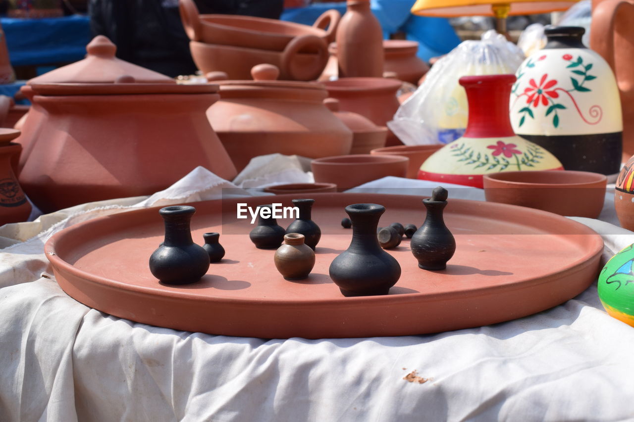 Close-up of small vases on table for sale