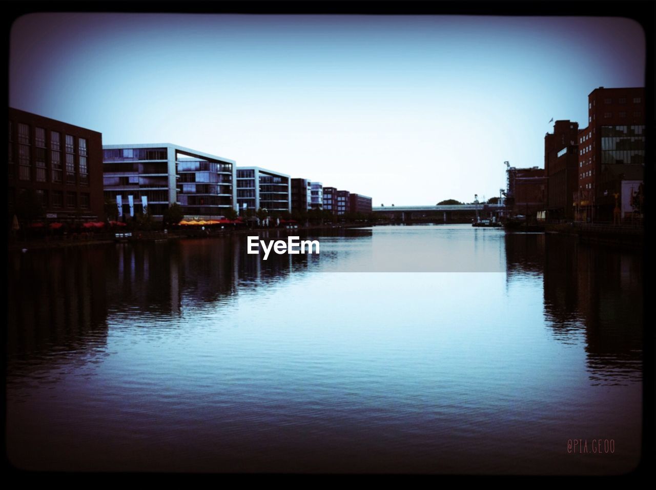 RIVER WITH BUILDINGS IN BACKGROUND