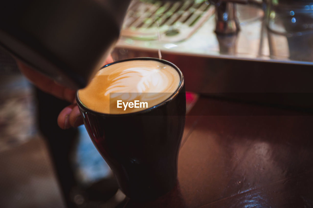 High angle view of cappuccino on table