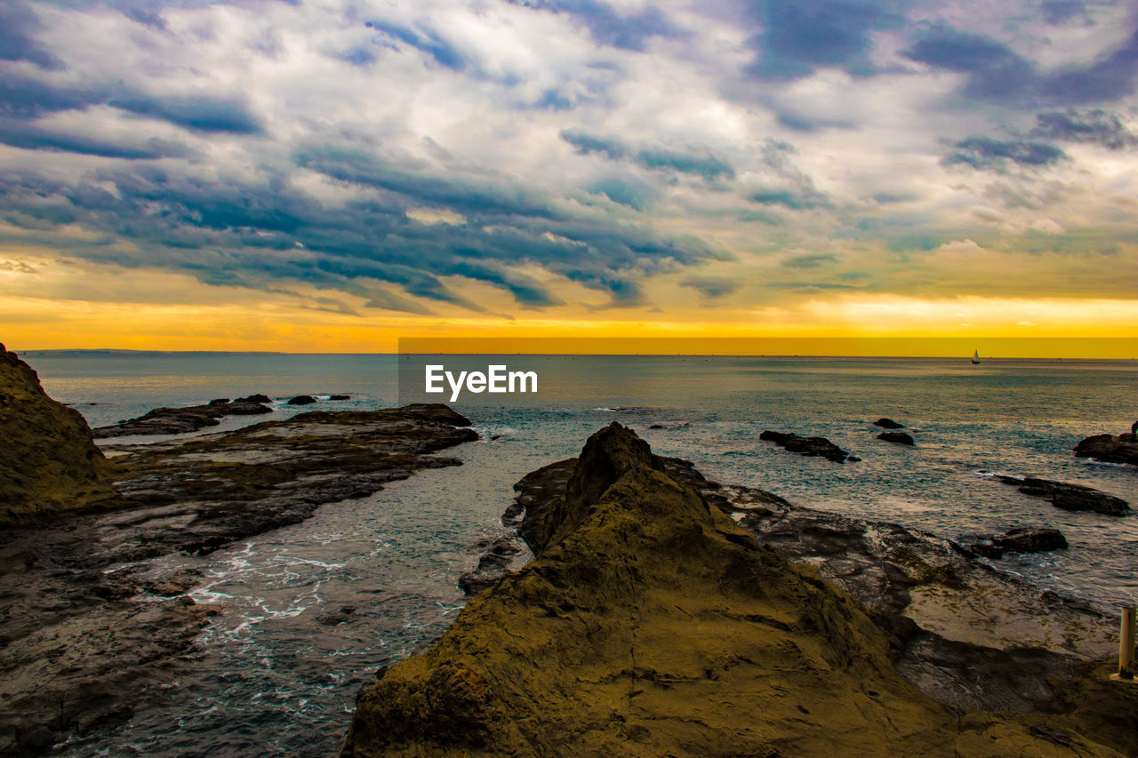 Scenic view of sea against sky during sunset