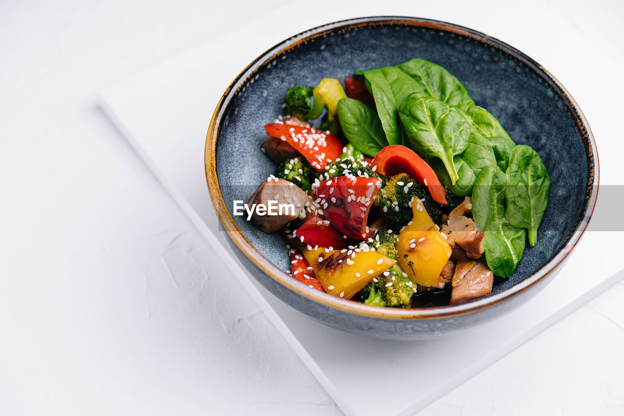 directly above shot of salad in bowl on white background