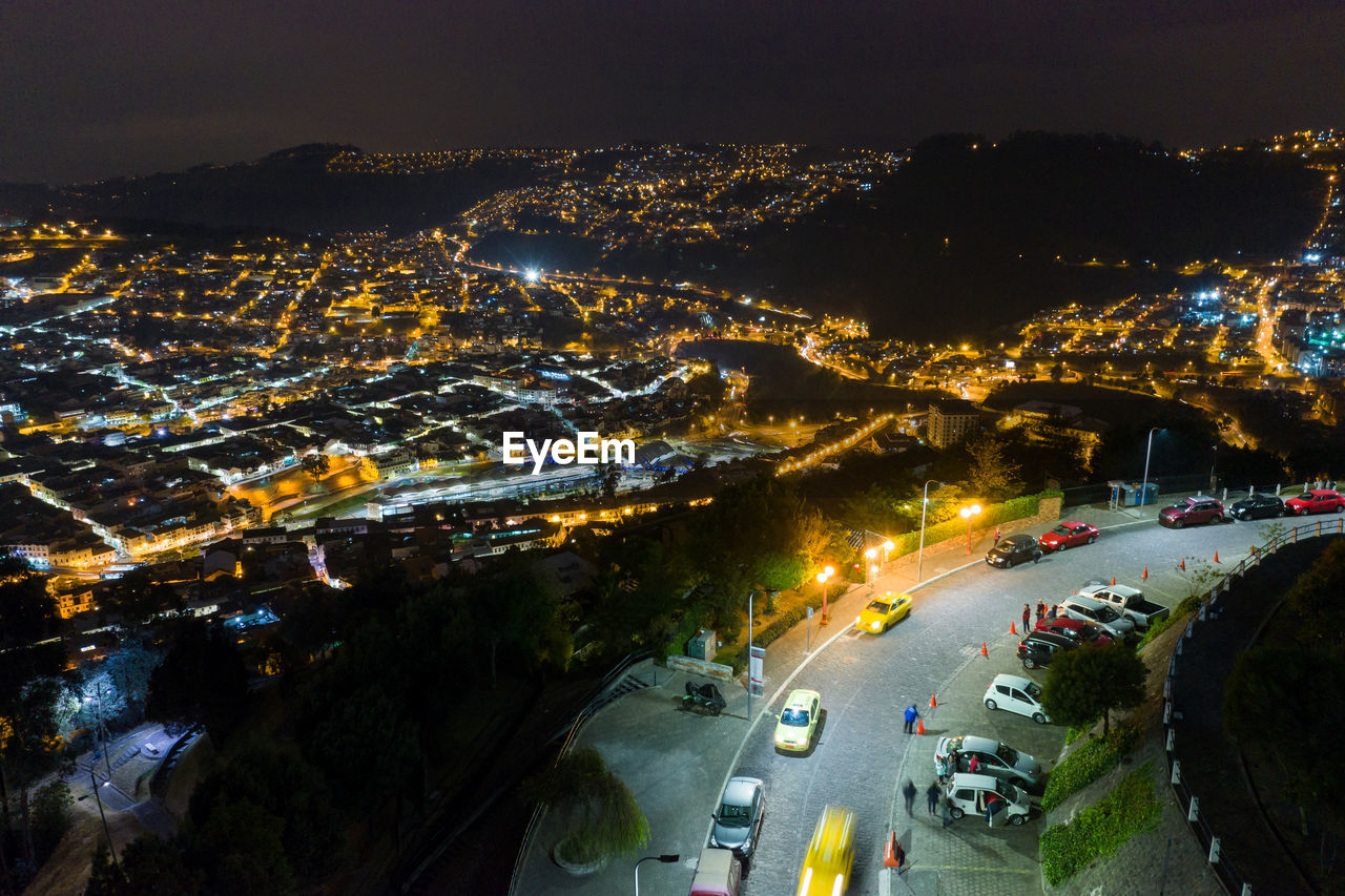 High angle view of illuminated city street at night