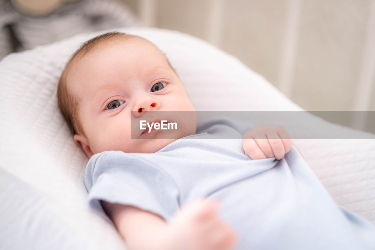 close-up of baby boy sleeping on bed