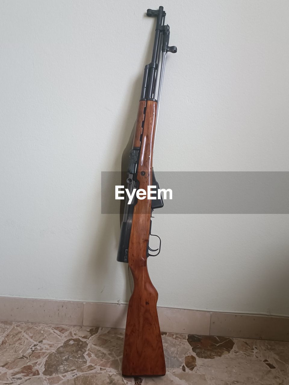weapon, firearm, wall - building feature, gun, indoors, no people, musical instrument, music