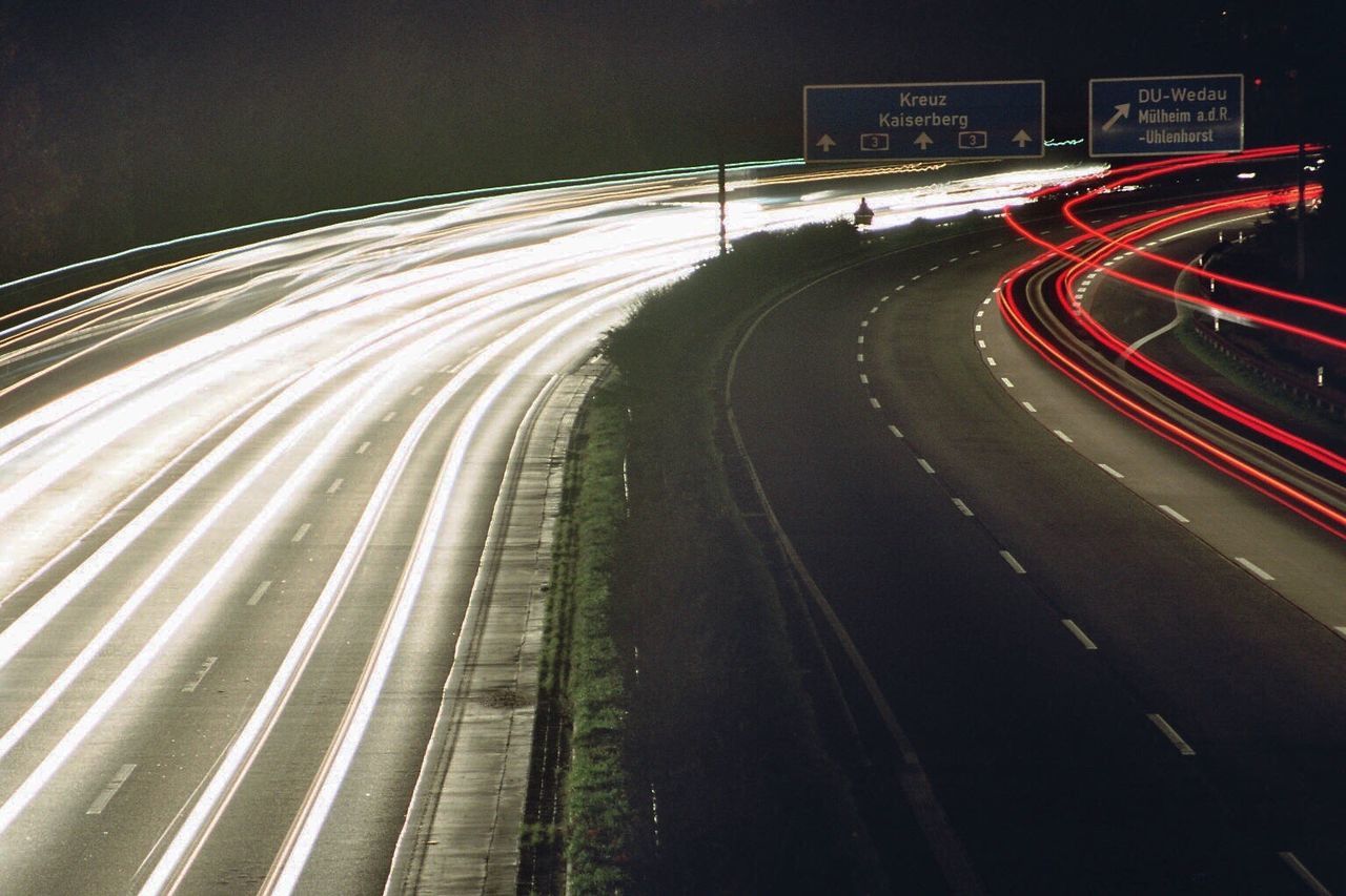 BLURRED MOTION OF LIGHT TRAILS ON ROAD