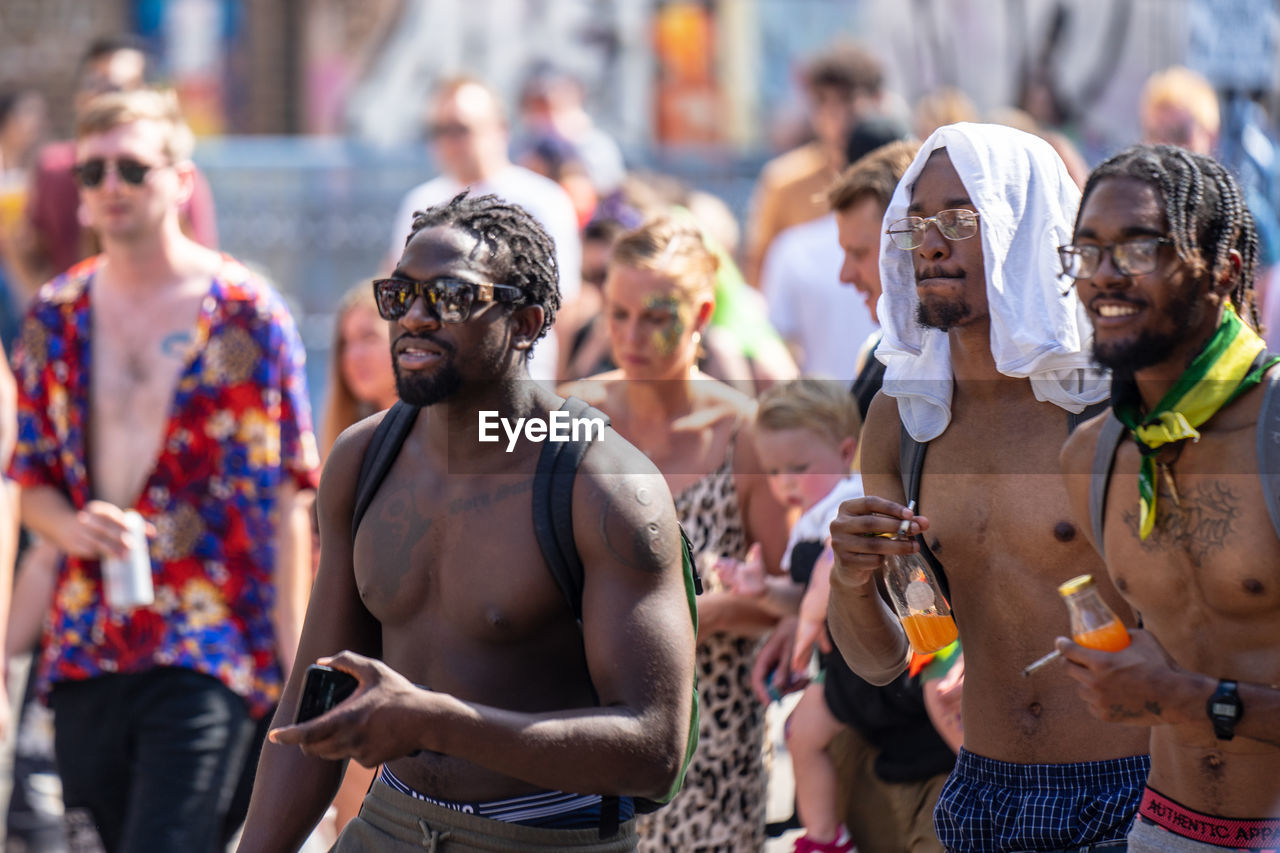 PEOPLE STANDING OUTDOORS