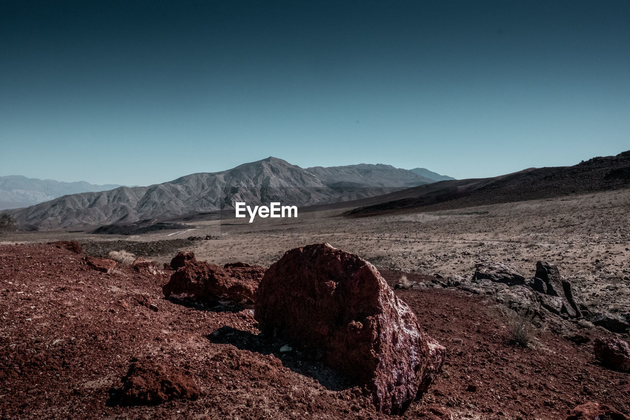 Scenic view of arid landscape against clear sky