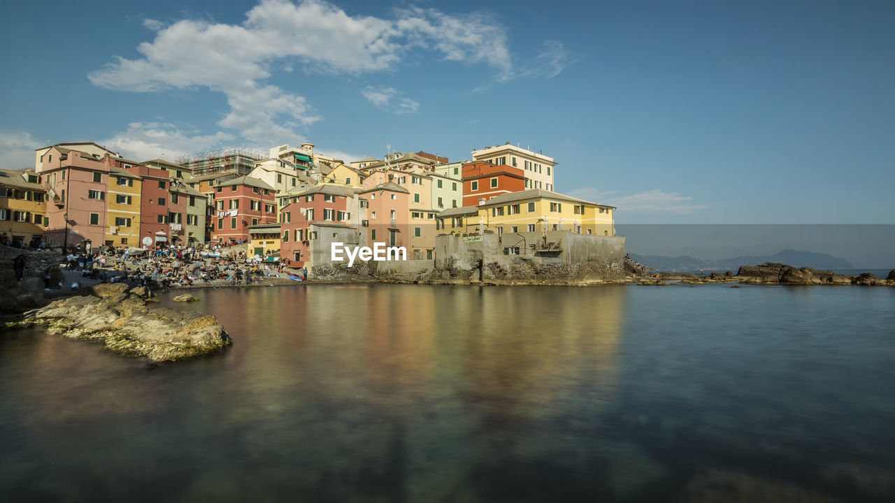 Typical fishing village with colored houses and crowded beach in the city of genoa
