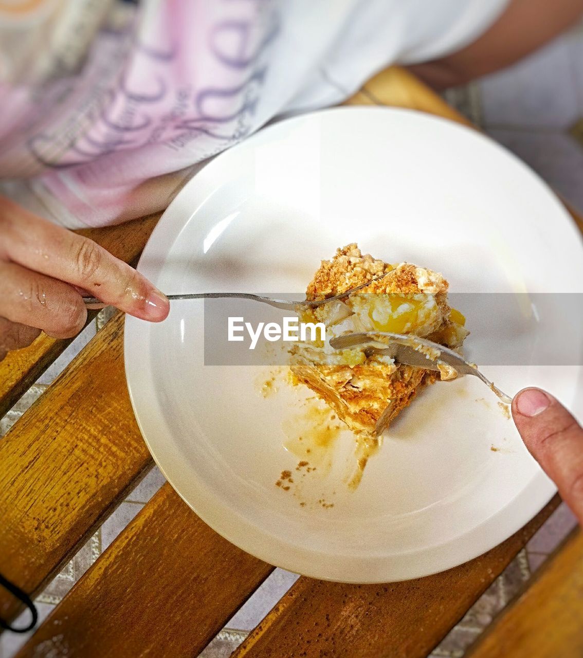 Close-up of woman eating ice cream in plate