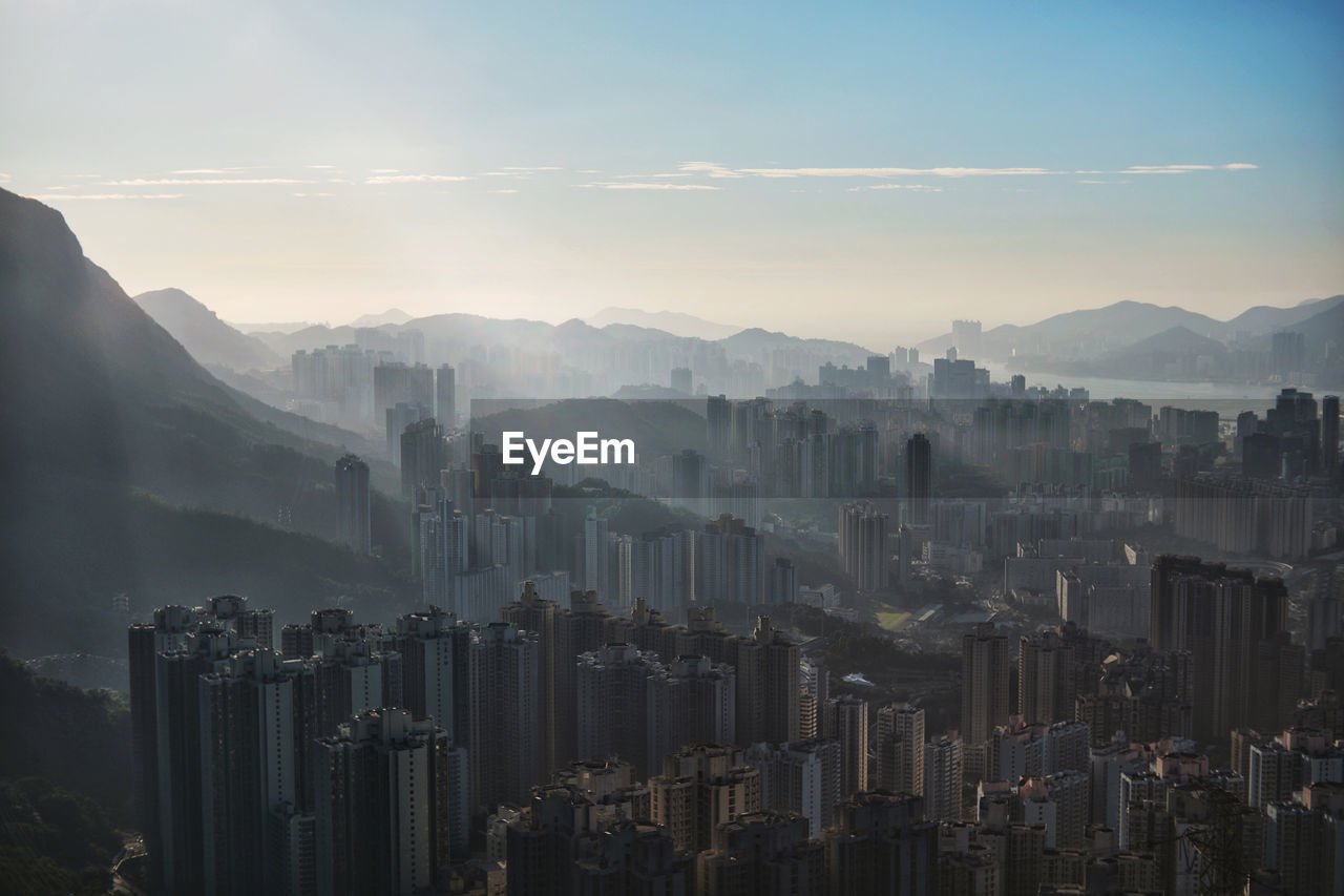 Panoramic view of buildings in city against sky