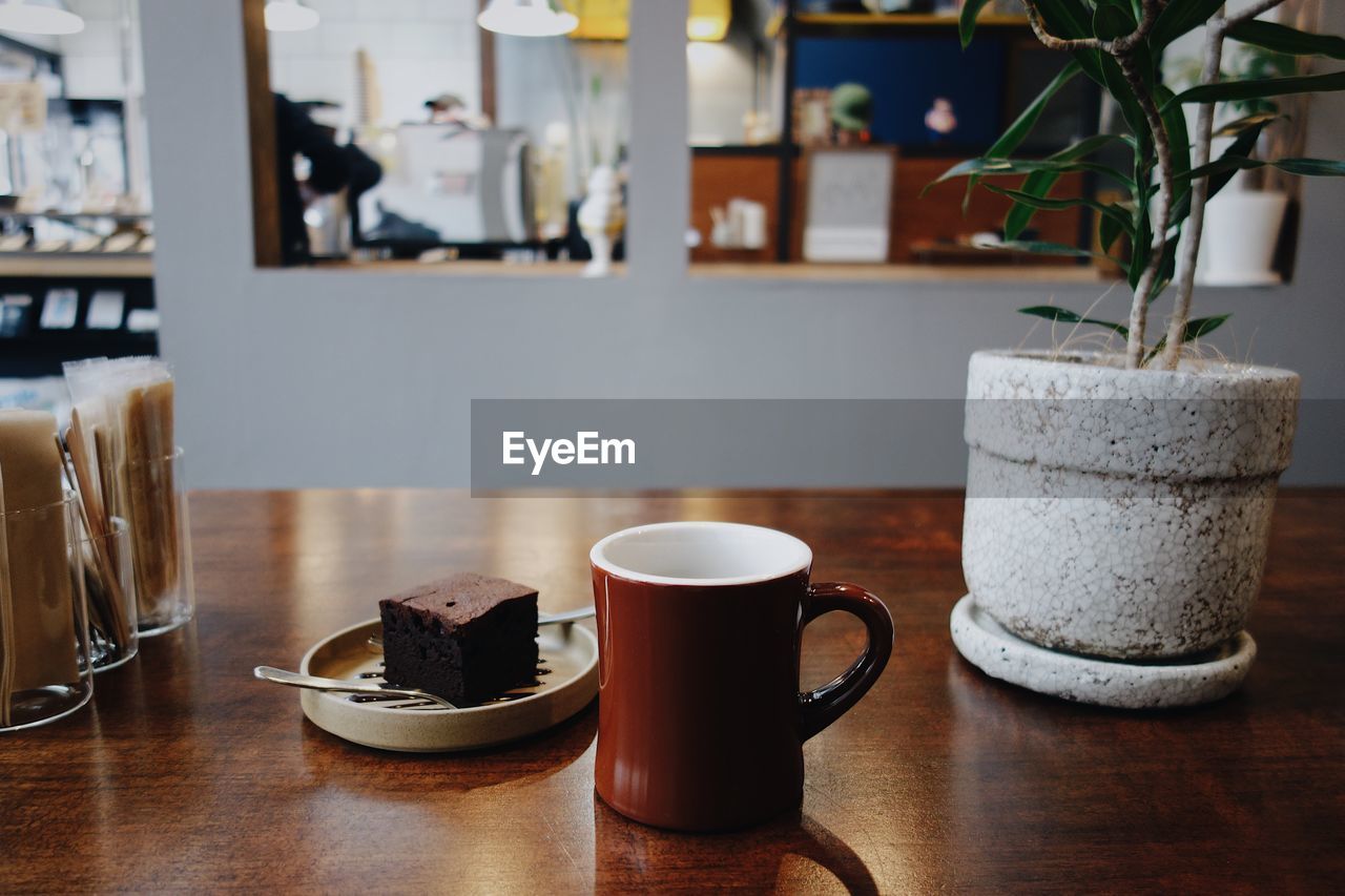 Close-up of coffee served on table at cafe