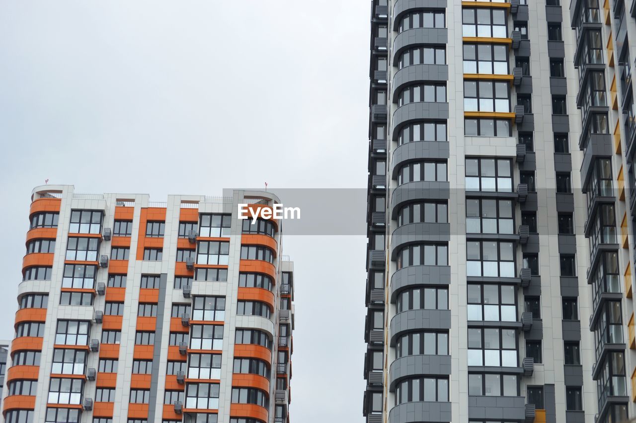 Low angle view of buildings in city against sky