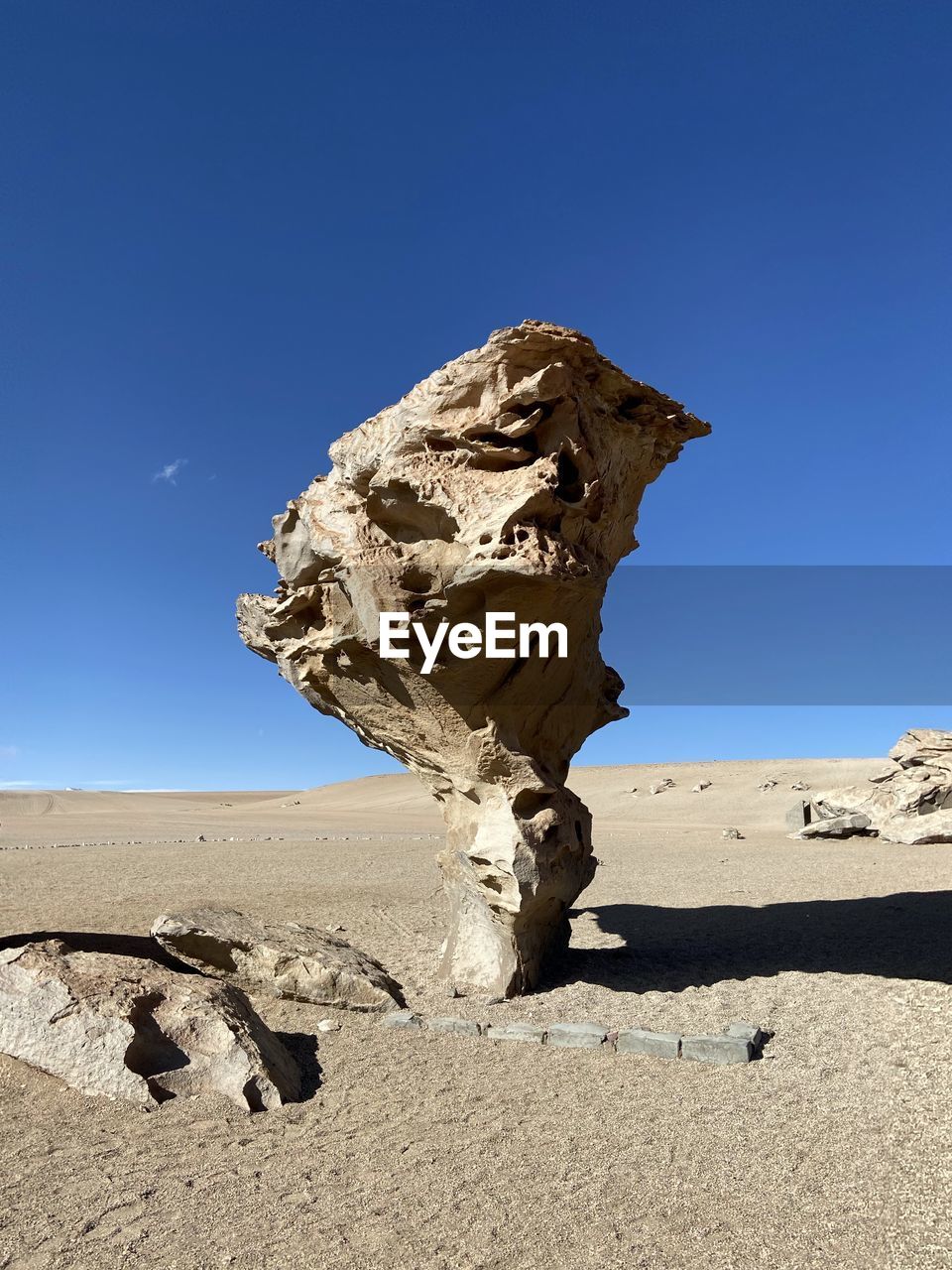 ROCK FORMATION ON LAND AGAINST SKY