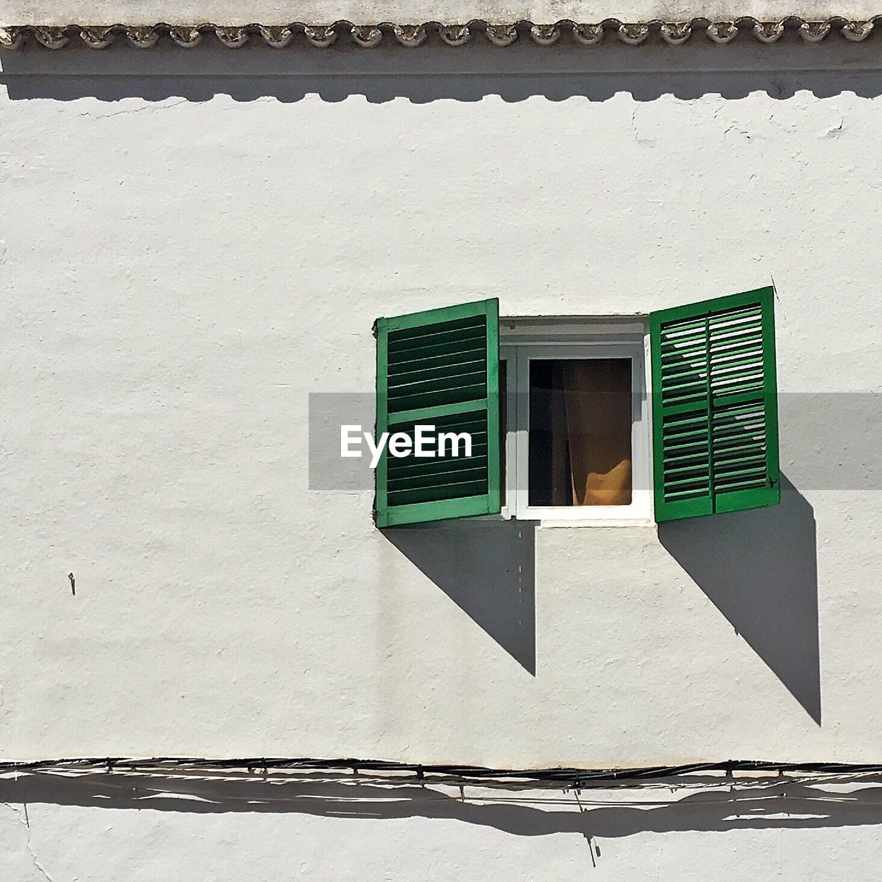 Low angle view of open window on building