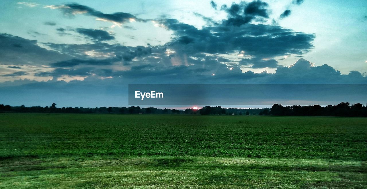 SCENIC VIEW OF LANDSCAPE AGAINST CLOUDY SKY